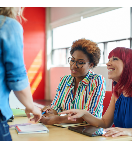 Unposed group of creative business people in an open concept office brainstorming their next project.