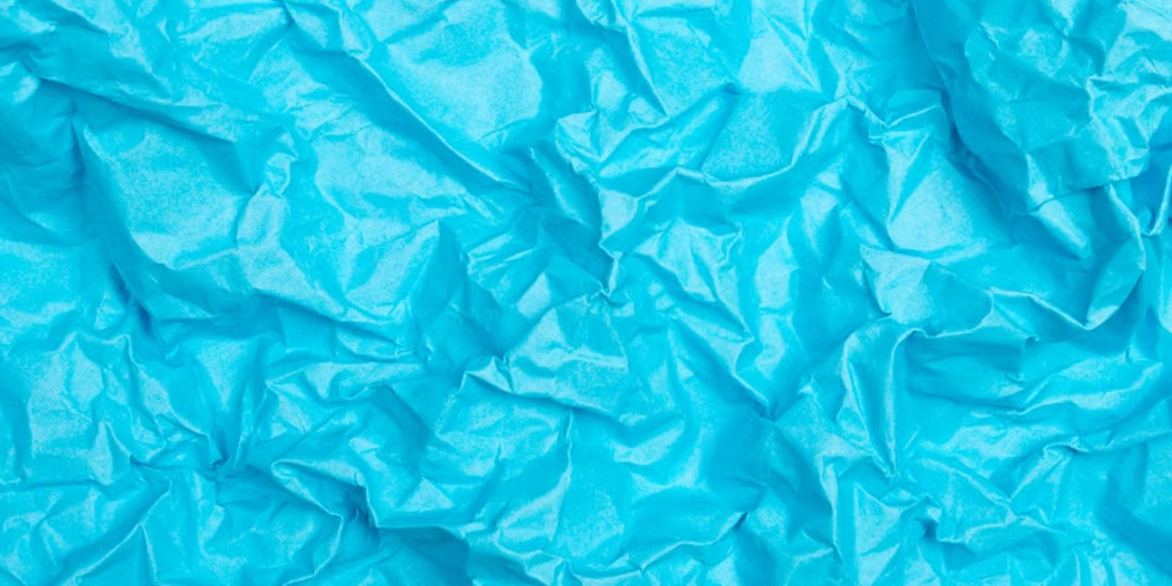 background image of a blue crumbled up paper
